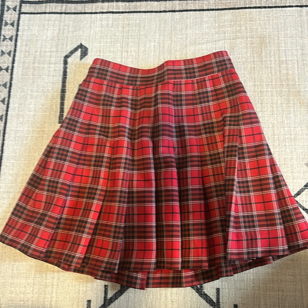 Red pleated skirt. High waisted.